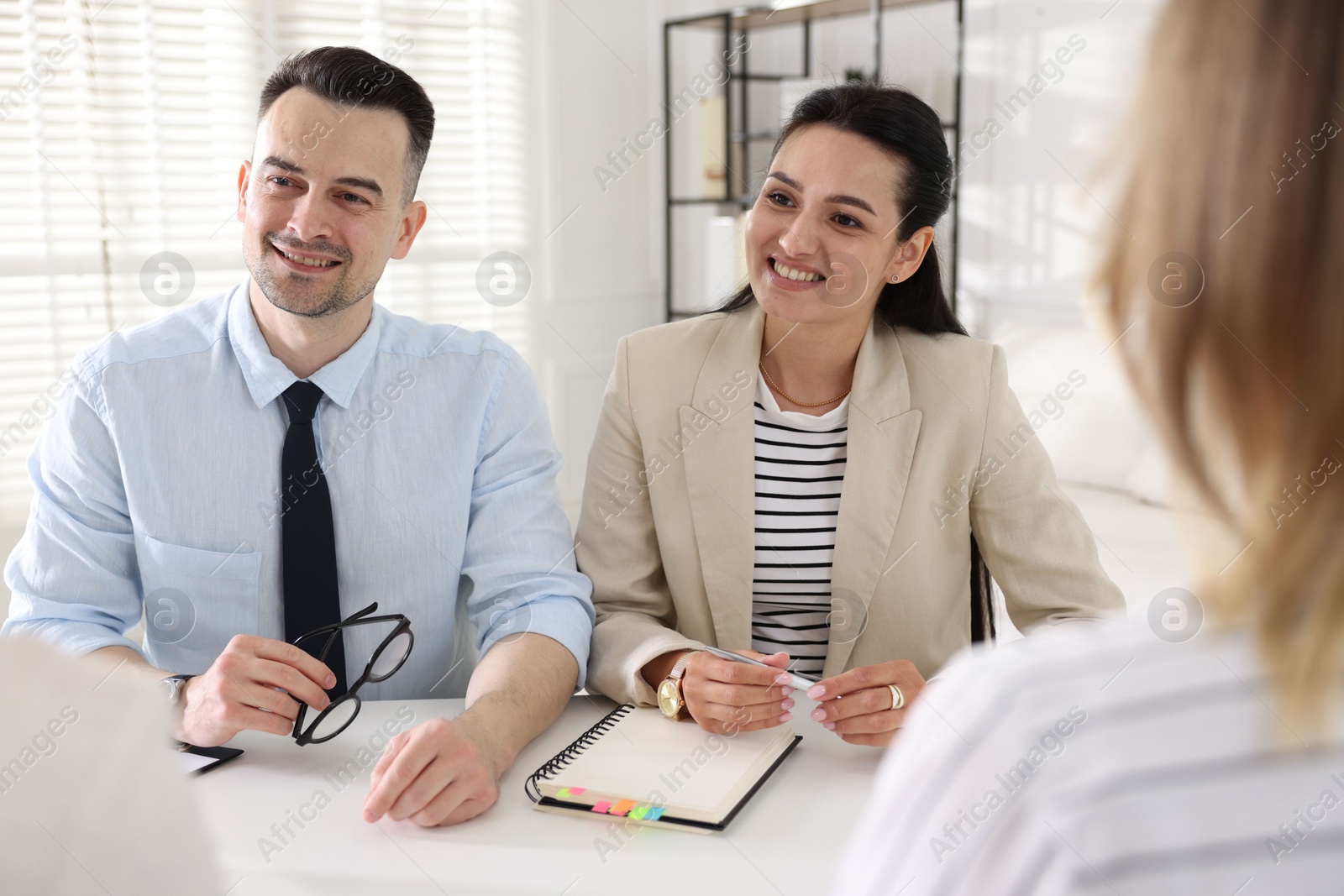 Marketing. Team of businesspeople working together at desk in office Photo of Marketing. Team of businesspeople working together at desk in office