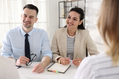 Photo of Marketing. Team of businesspeople working together at desk in office