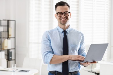 Photo of Marketing. Happy man with laptop in office, space for text