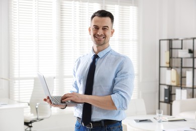 Photo of Marketing. Happy man with laptop in office
