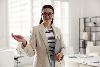 Photo of Marketing. Happy woman with laptop in office