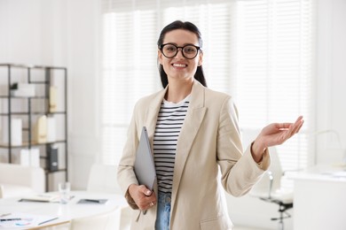 Photo of Marketing. Happy woman with laptop in office