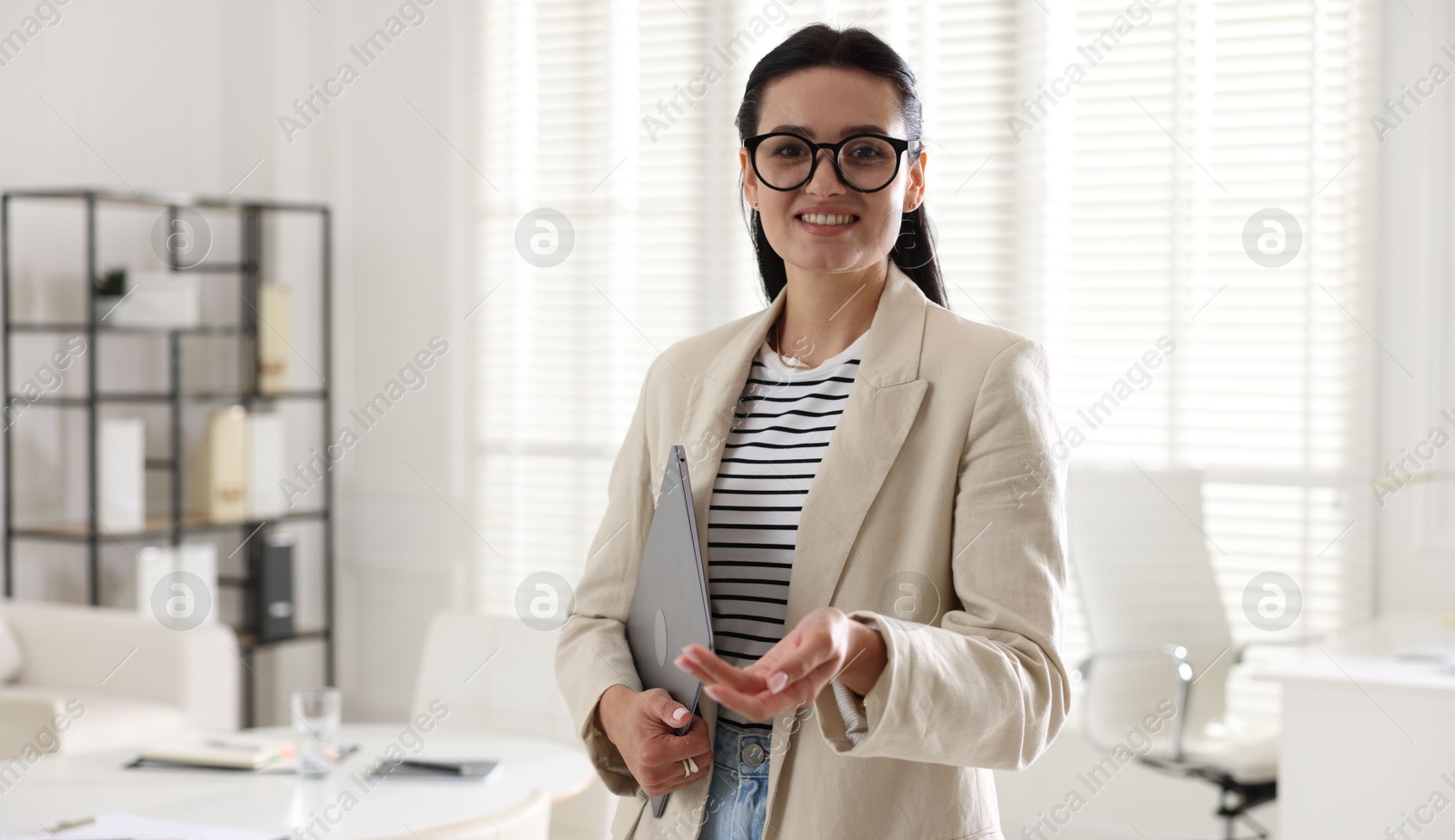 Marketing. Happy woman with laptop in office Photo of Marketing. Happy woman with laptop in office