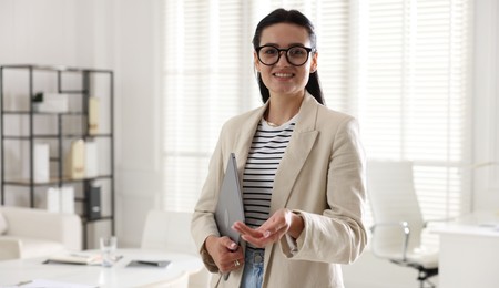Photo of Marketing. Happy woman with laptop in office