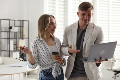 Photo of Marketing. Two colleagues working together in office