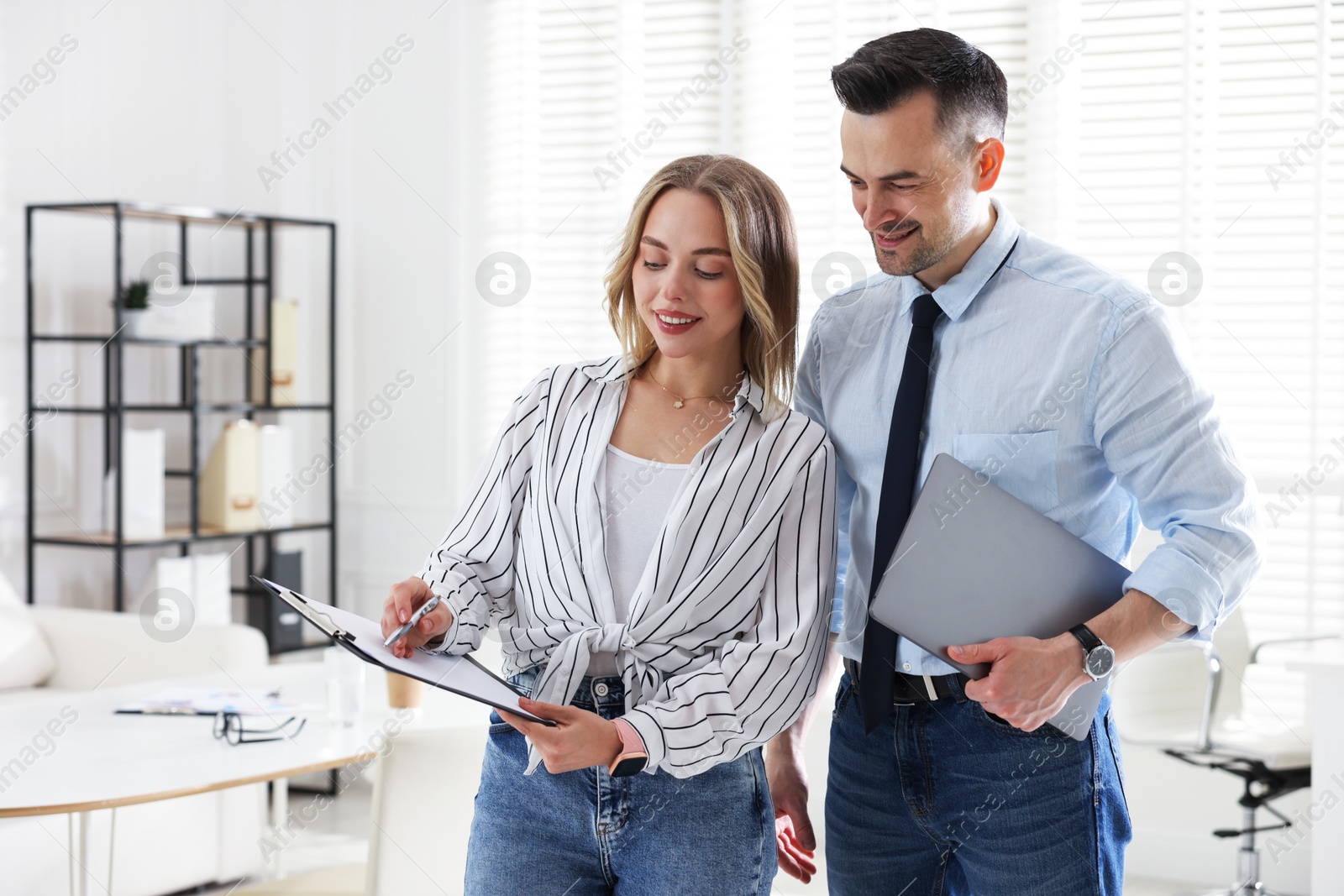 Marketing. Two colleagues working together in office Photo of Marketing. Two colleagues working together in office