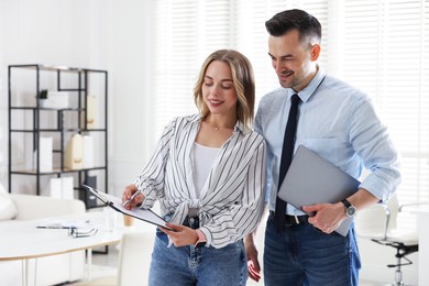 Photo of Marketing. Two colleagues working together in office