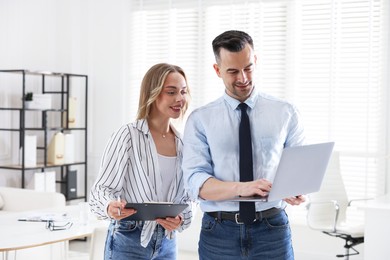 Photo of Marketing. Two colleagues working together in office