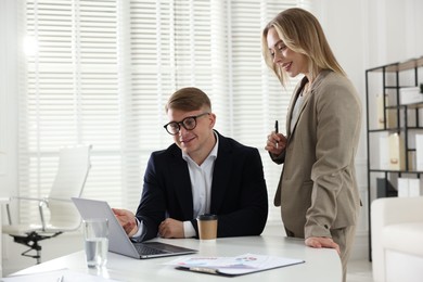 Photo of Marketing. Two colleagues working together in office