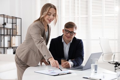 Photo of Marketing. Two colleagues working together in office