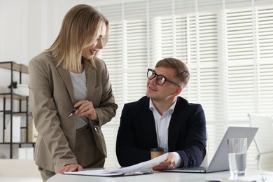Photo of Marketing. Two colleagues working together in office