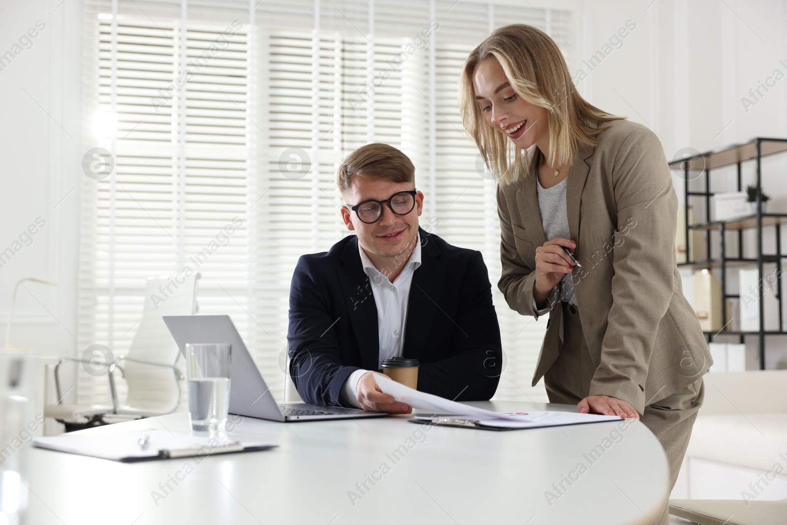 Marketing. Two colleagues working together in office Photo of Marketing. Two colleagues working together in office