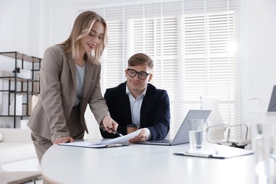 Photo of Marketing. Two colleagues working together in office