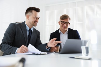 Photo of Marketing. Two colleagues working together in office
