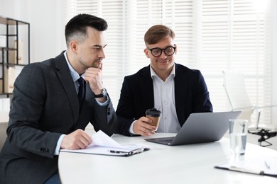 Photo of Marketing. Two colleagues working together in office