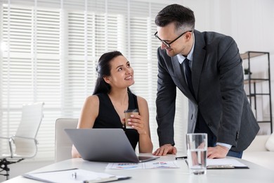Photo of Marketing. Two colleagues working together in office