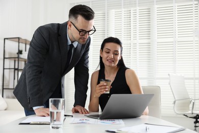 Photo of Marketing. Two colleagues working together in office