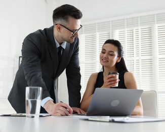 Photo of Marketing. Two colleagues working together in office