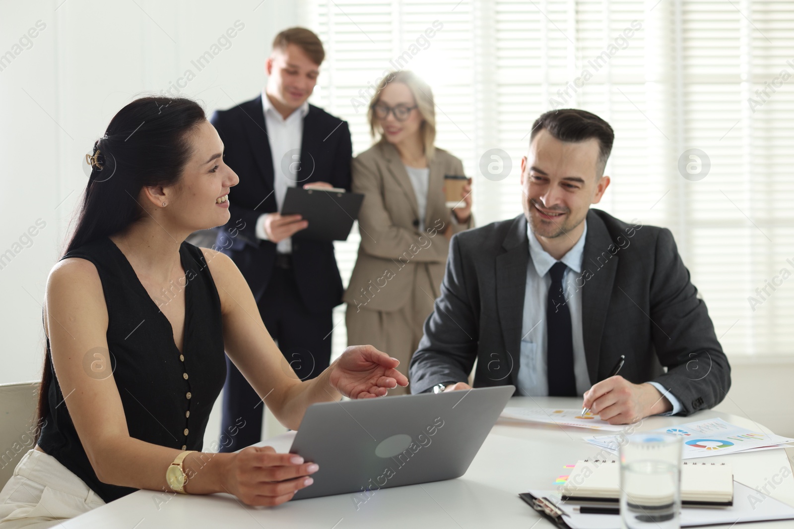 Marketing. Businesspeople working together in office, selective focus Photo of Marketing. Businesspeople working together in office, selective focus