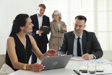 Photo of Marketing. Businesspeople working together in office, selective focus