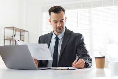 Photo of Marketing. Man working at desk in office