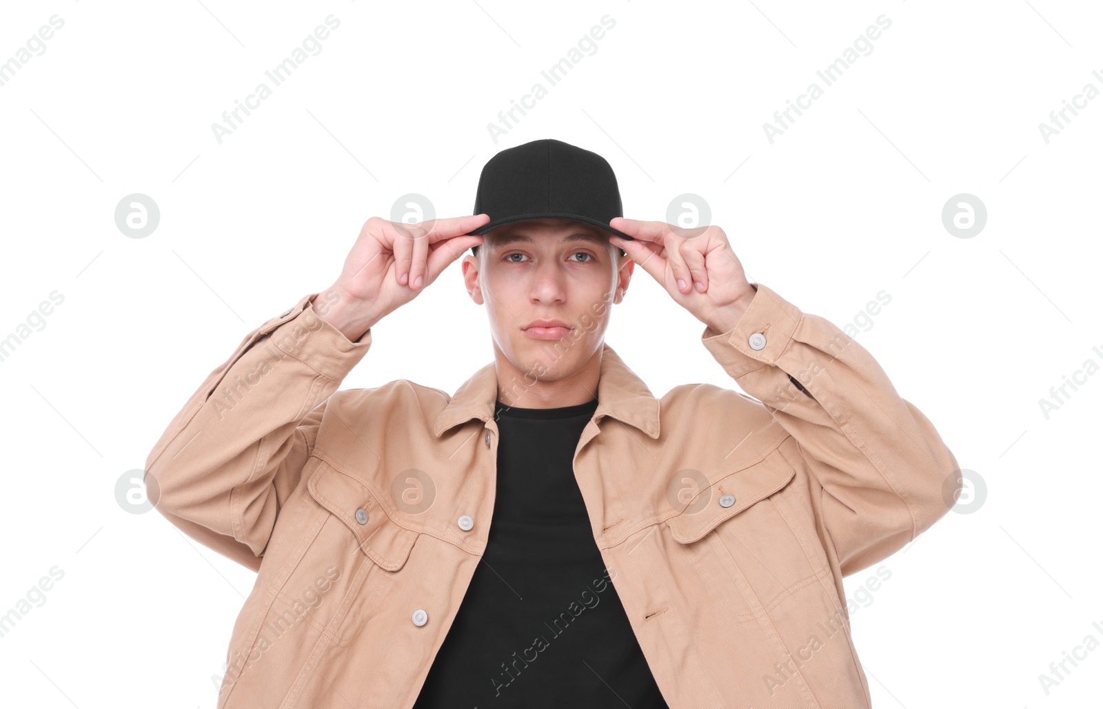 Young man wearing stylish black baseball hat on white background Photo of Young man wearing stylish black baseball hat on white background