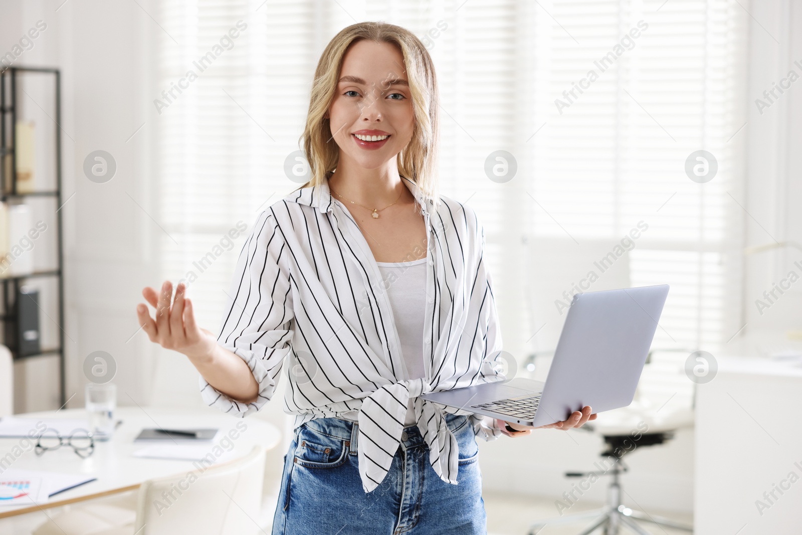 Photo of Marketing. Happy woman with laptop in office