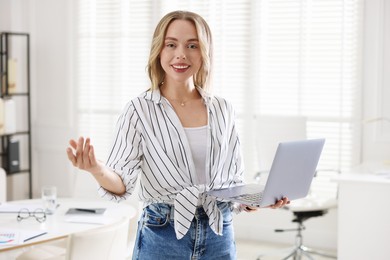 Photo of Marketing. Happy woman with laptop in office