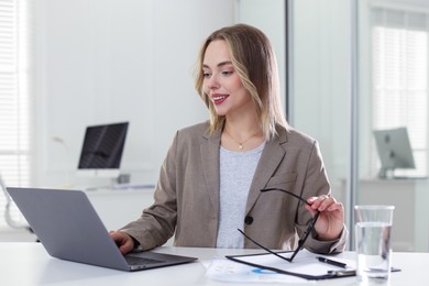 Photo of Marketing. Woman working with laptop at desk in office