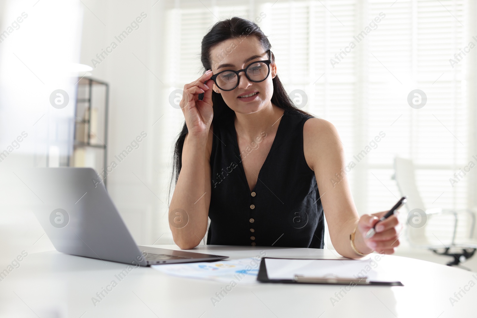 Marketing. Woman working at desk in office Photo of Marketing. Woman working at desk in office