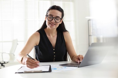 Photo of Marketing. Woman working at desk in office