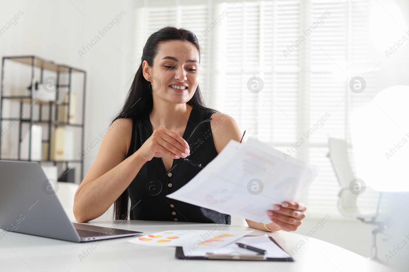 Photo of Marketing. Woman working at desk in office