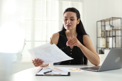Photo of Marketing. Woman working at desk in office