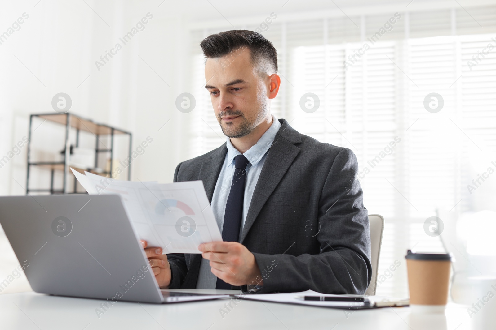 Marketing. Man working at desk in office Photo of Marketing. Man working at desk in office