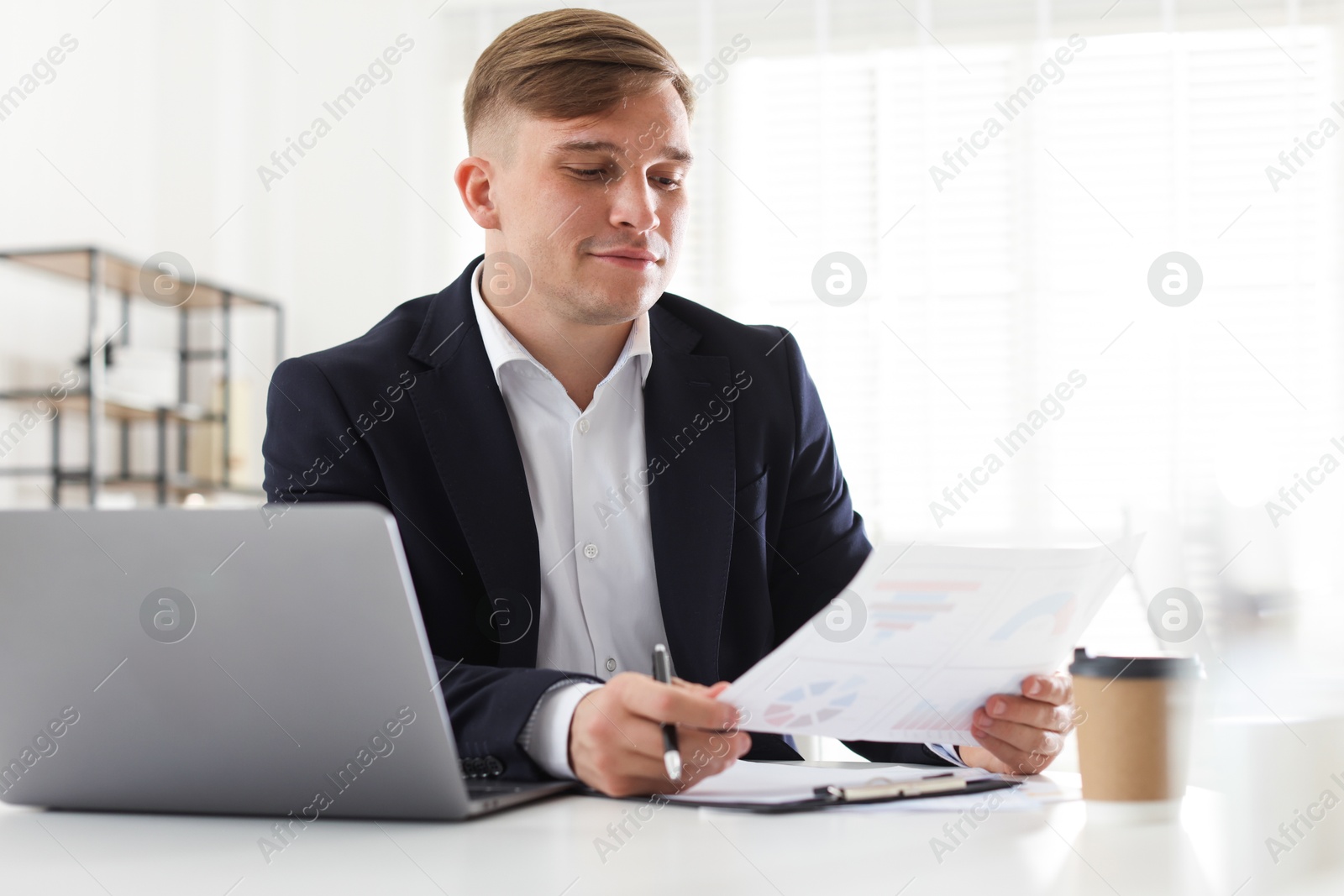 Marketing. Man working at desk in office Photo of Marketing. Man working at desk in office