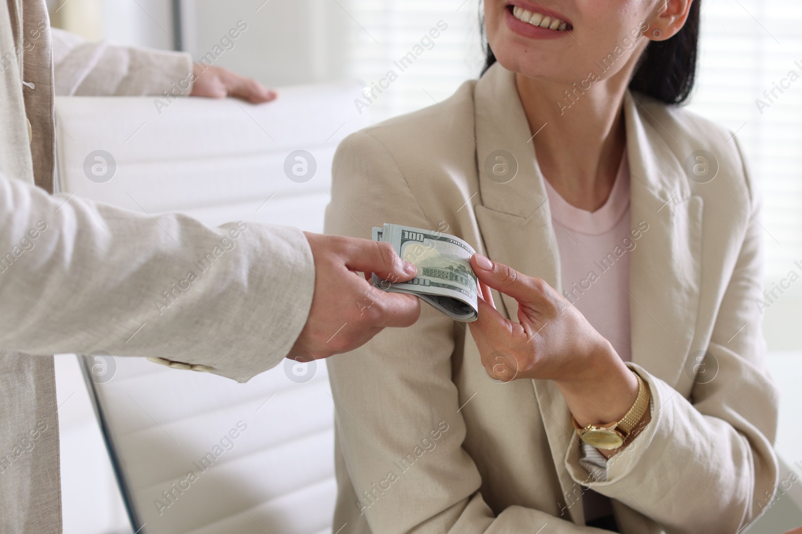 Bonus. Employee receiving money from boss in office, closeup Photo of Bonus. Employee receiving money from boss in office, closeup