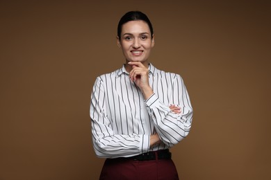 Photo of Portrait of confident business woman on brown background