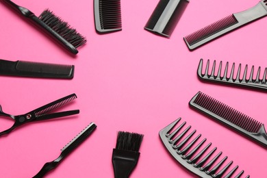 Photo of Frame of different hairdresser's tools on pink background, flat lay. Space for text