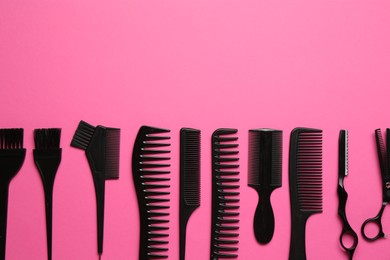 Photo of Different hairdresser's tools on pink background, flat lay. Space for text