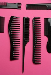 Photo of Different hairdresser's tools on pink background, flat lay