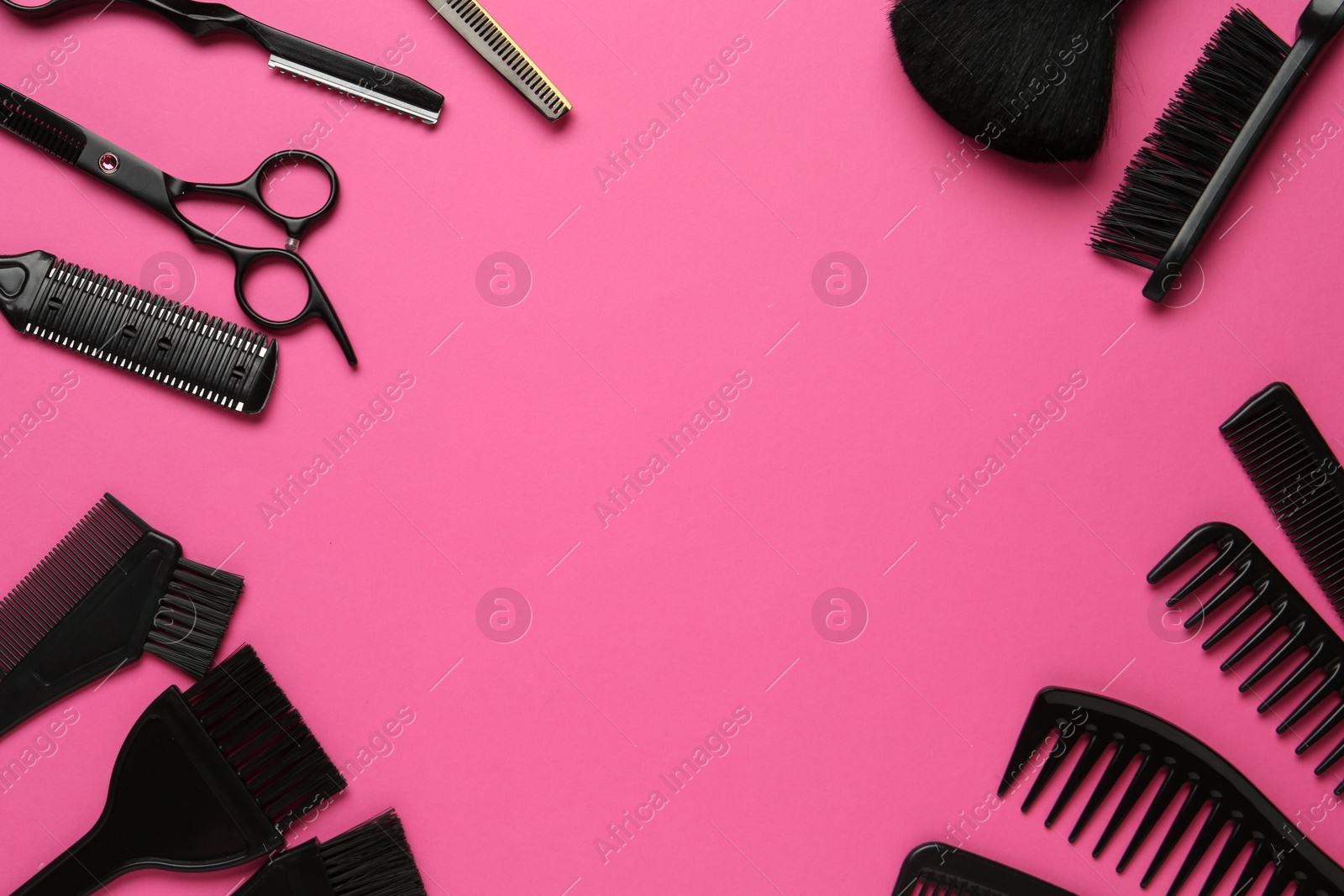 Photo of Frame of different hairdresser's tools on pink background, flat lay. Space for text