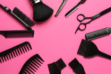 Photo of Frame of different hairdresser's tools on pink background, flat lay. Space for text