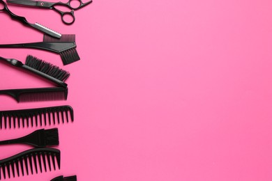 Photo of Different hairdresser's tools on pink background, flat lay. Space for text
