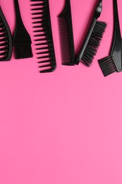 Photo of Different hairdresser's tools on pink background, flat lay. Space for text