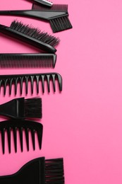 Photo of Different hairdresser's tools on pink background, flat lay. Space for text
