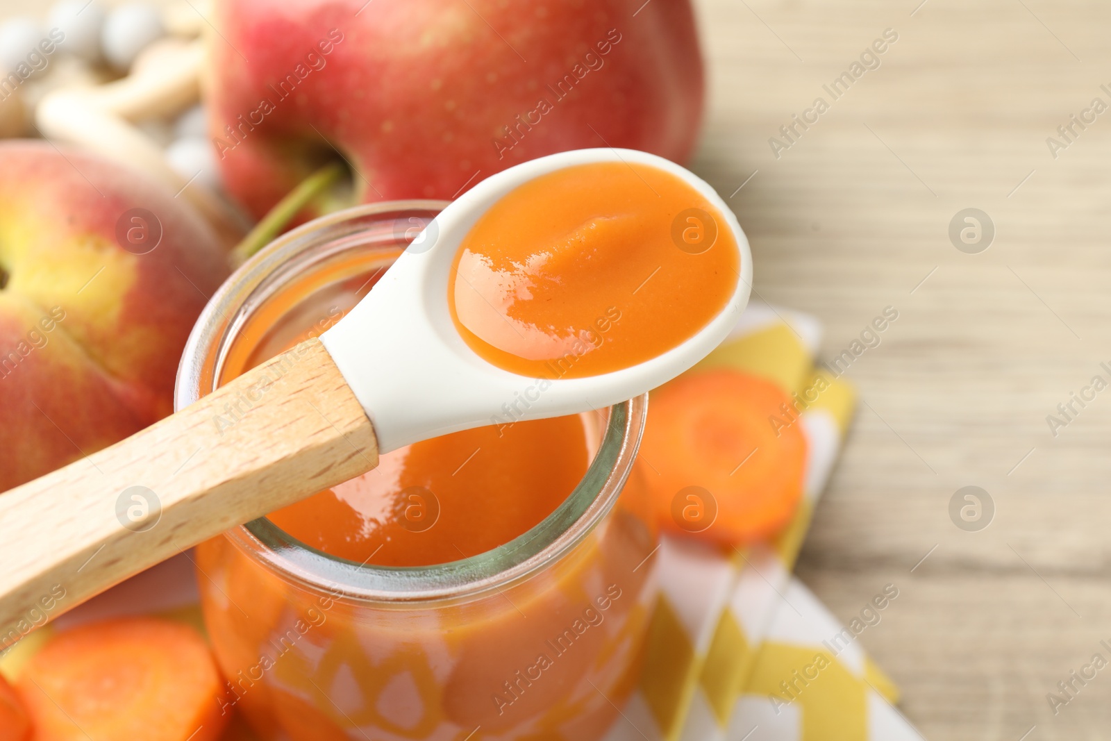 Baby food. Tasty puree in jar, ingredients and spoon on table, closeup. Space for text Photo of Baby food. Tasty puree in jar, ingredients and spoon on table, closeup. Space for text
