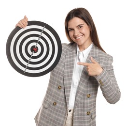 Photo of Targeting. Smiling businesswoman pointing at dart board on white background