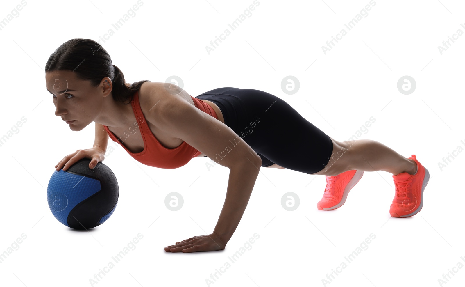 Athletic woman exercising with medicine ball on white background Photo of Athletic woman exercising with medicine ball on white background