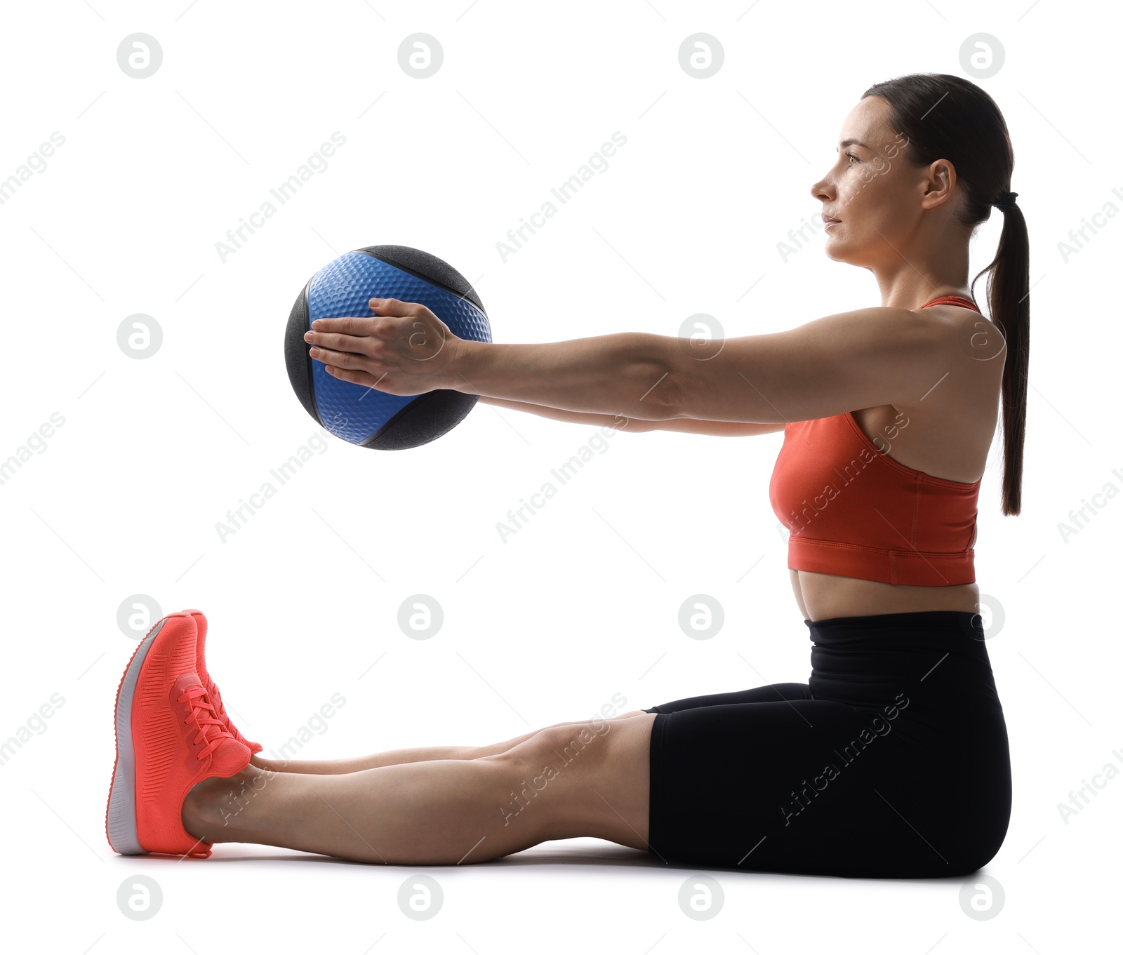 Athletic woman exercising with medicine ball on white background Photo of Athletic woman exercising with medicine ball on white background