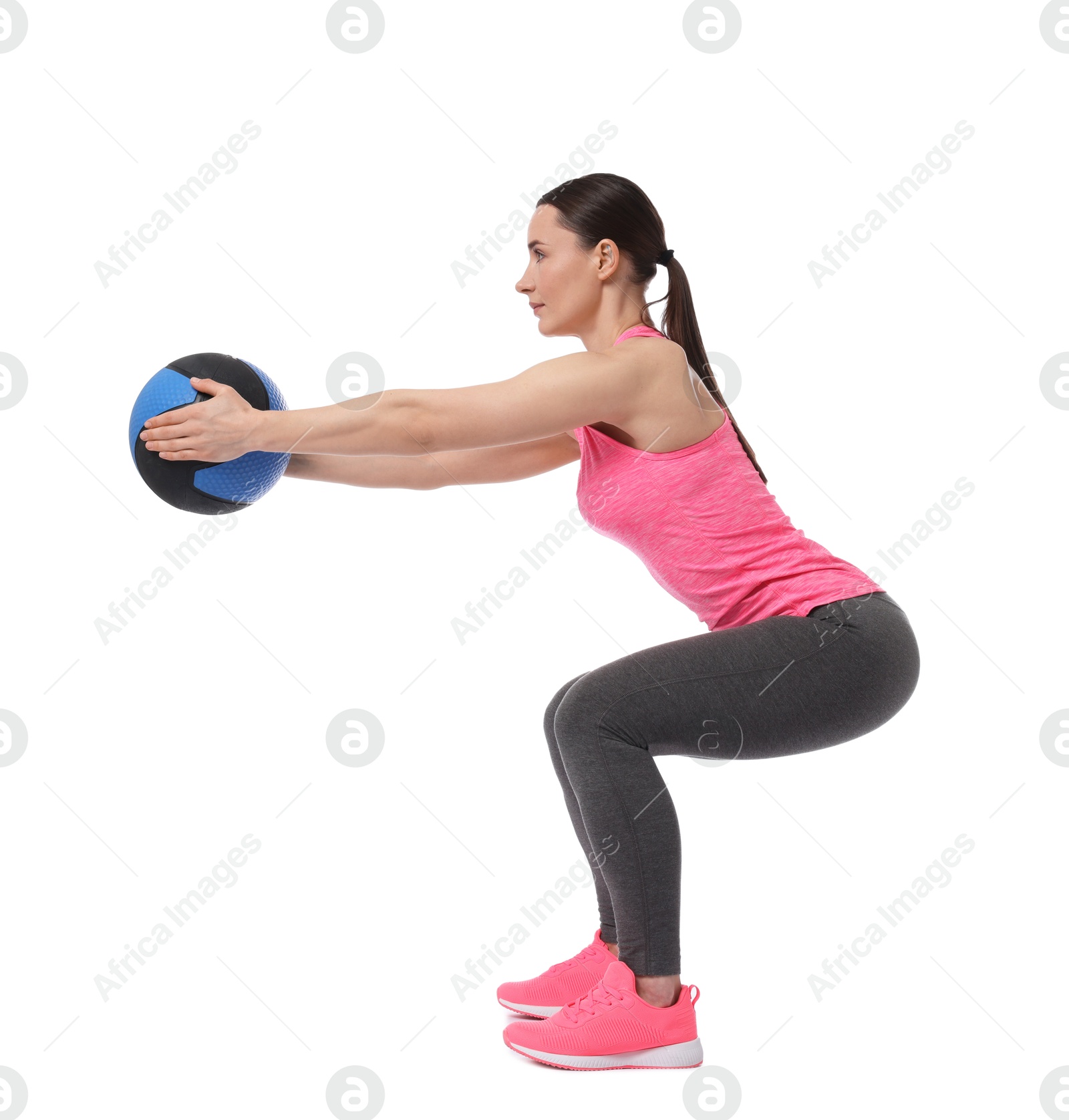 Photo of Athletic woman exercising with medicine ball on white background